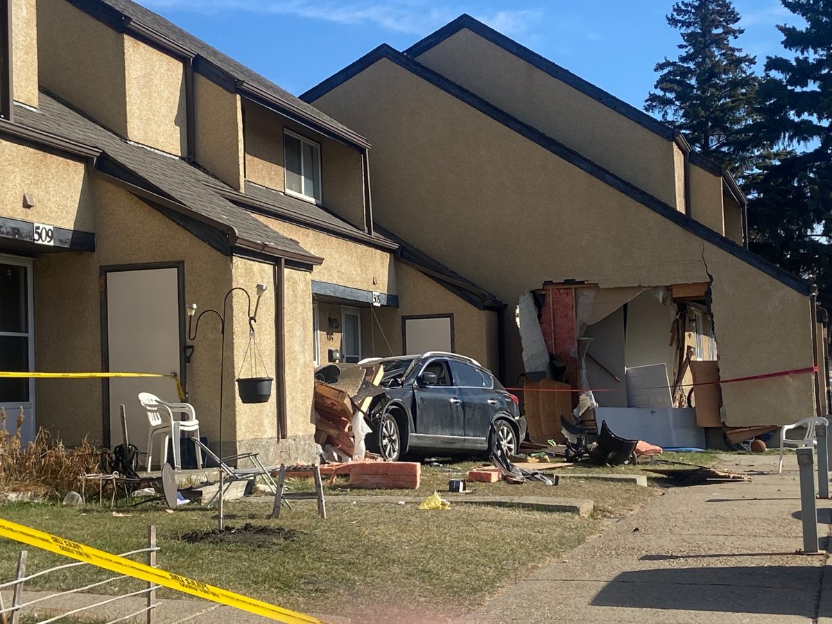 Police in Edmonton are investigating what caused an SUV to crash into a townhouse complex Sunday morning.