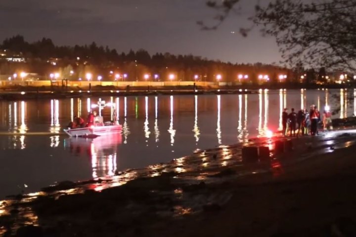 ‘Lights on’: Coquitlam RCMP see vehicle submerged in Fraser River, unable to reach it