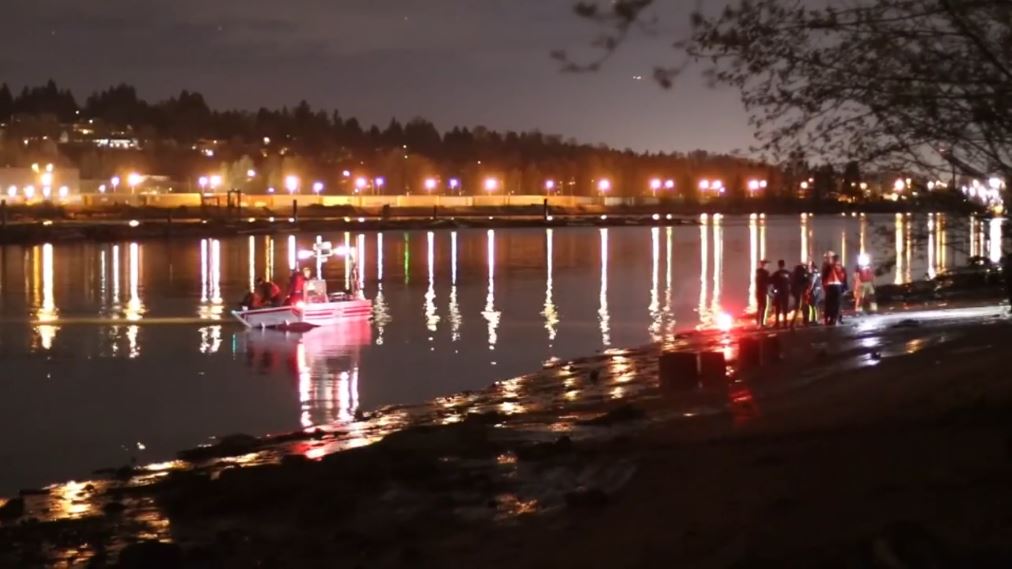 ‘Lights on’: Coquitlam RCMP see vehicle submerged in Fraser River, unable to reach it