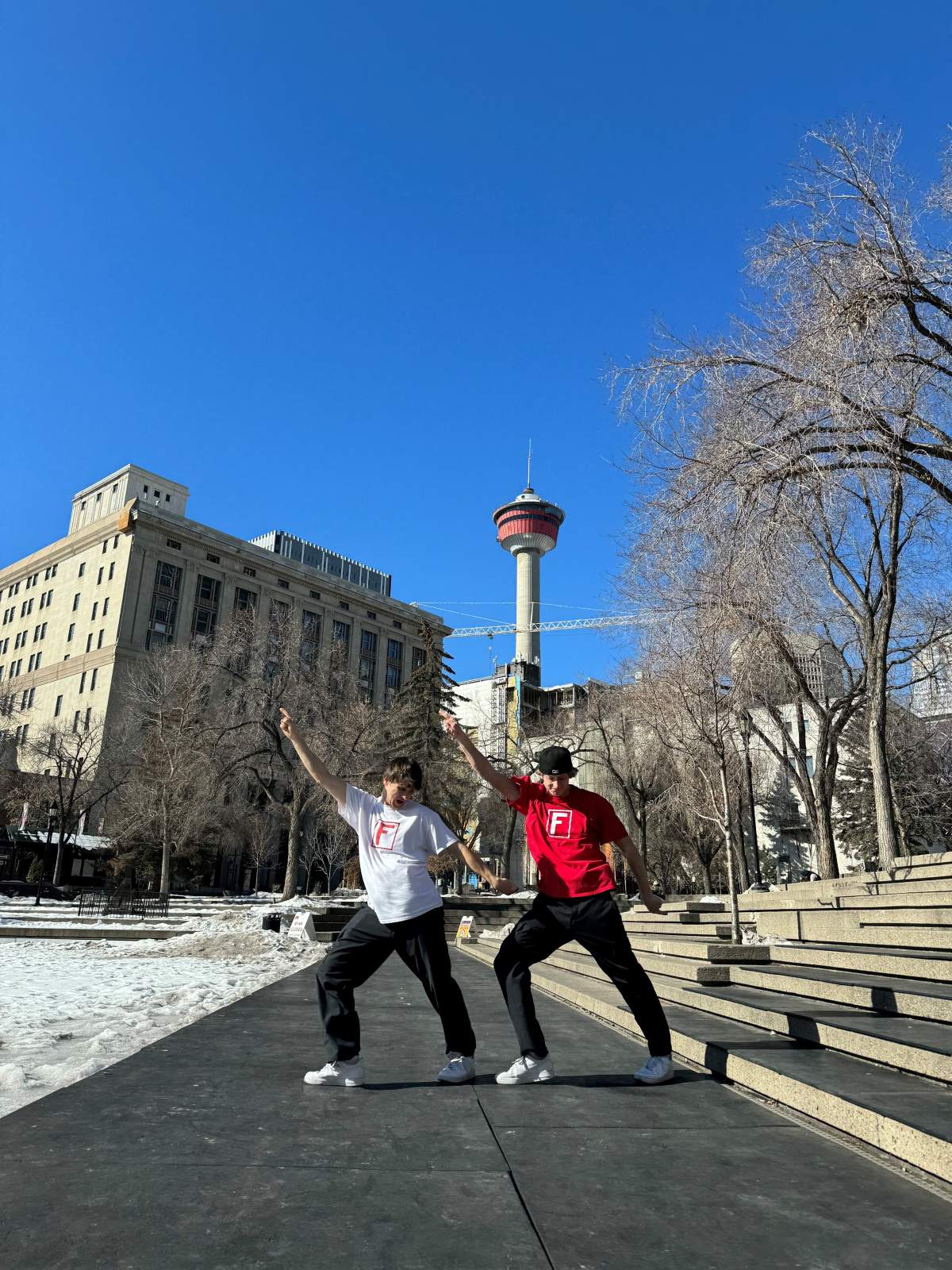 Jackson Fryer and Carlow Rush dancing at the Olympic Plaza in Calgary.