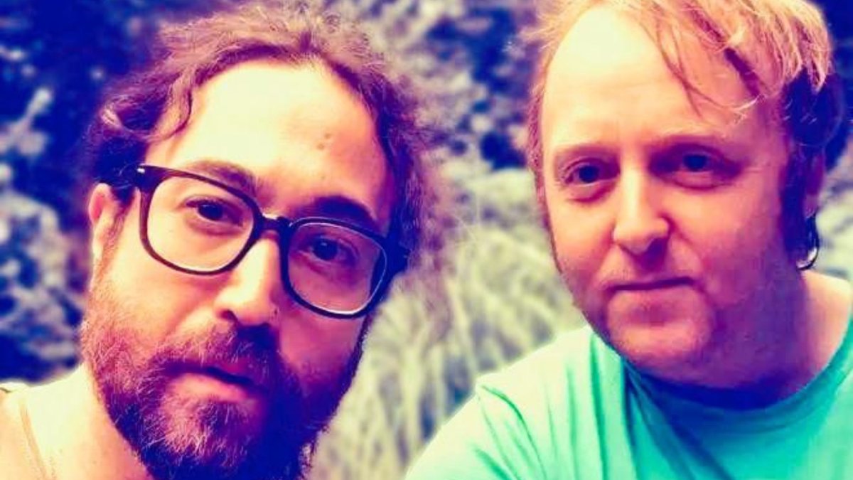 James McCartney and Sean Ono Lennon. There is an orangeish filter on the selfie.