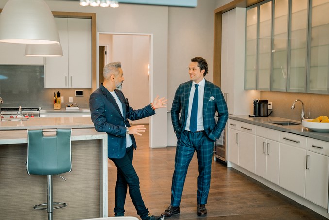 Luxury real estate agents Peter Torkan and Brett Starke play up their relationship as friendly rivals.