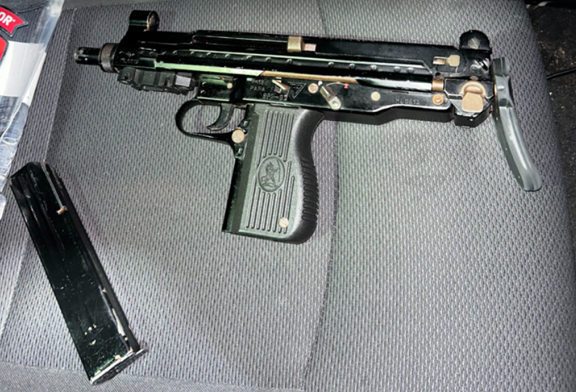 Police searched the vehicle and allegedly found a loaded modified Uzi submachine gun with a high-capacity magazine. .