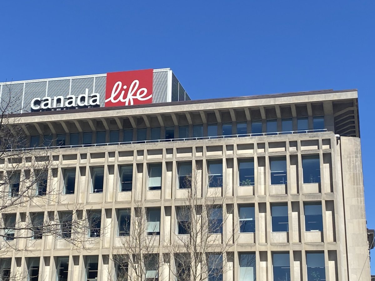A picture of a large office building with blue skies and the Canada Life sign on top.