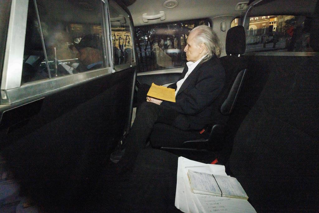 Seen through a police vehicle window, Peter Nygard arrives to a courthouse in Toronto on Tuesday, Oct. 3, 2023. The Manitoba Court of Appeal has dismissed Nygard’s application for a judicial review of the federal justice minister’s extradition order. THE CANADIAN PRESS/Cole Burston.