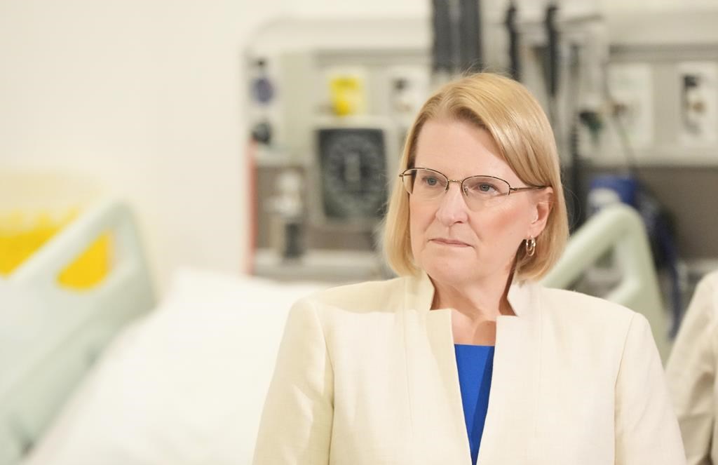  Ontario Health Minister Sylvia Jones stands next to a hospital bed as she attends an announcement at Seneca College, in King City, Ont., Friday, Feb. 9, 2024.