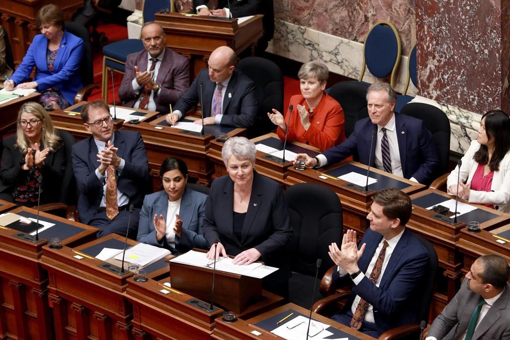 British Columbia's finance minister says she will retire after the provincial election this fall, having served in the legislature for nearly two decades. Finance Minister Katrine Conroy tables the budget in the legislative assembly at the legislature in Victoria, Thursday, Feb. 22, 2024. THE CANADIAN PRESS/Chad Hipolito.