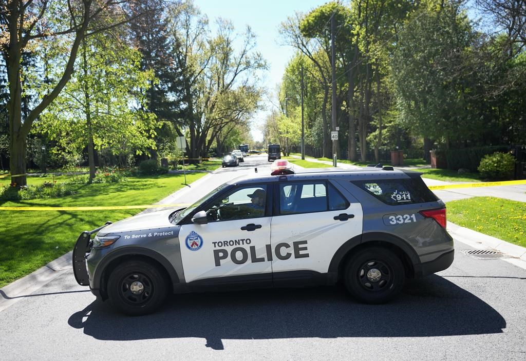Toronto Police investigate a crime scene outside the mansion of Canadian rap mogul Drake in Toronto's Bridle Path neighbourhood on Tuesday, May 7, 2024. Police allege a man accused of trespassing at Drake's Toronto home earlier this week returned to the property Saturday to retrieve his bike. THE CANADIAN PRESS/Nathan Denette.