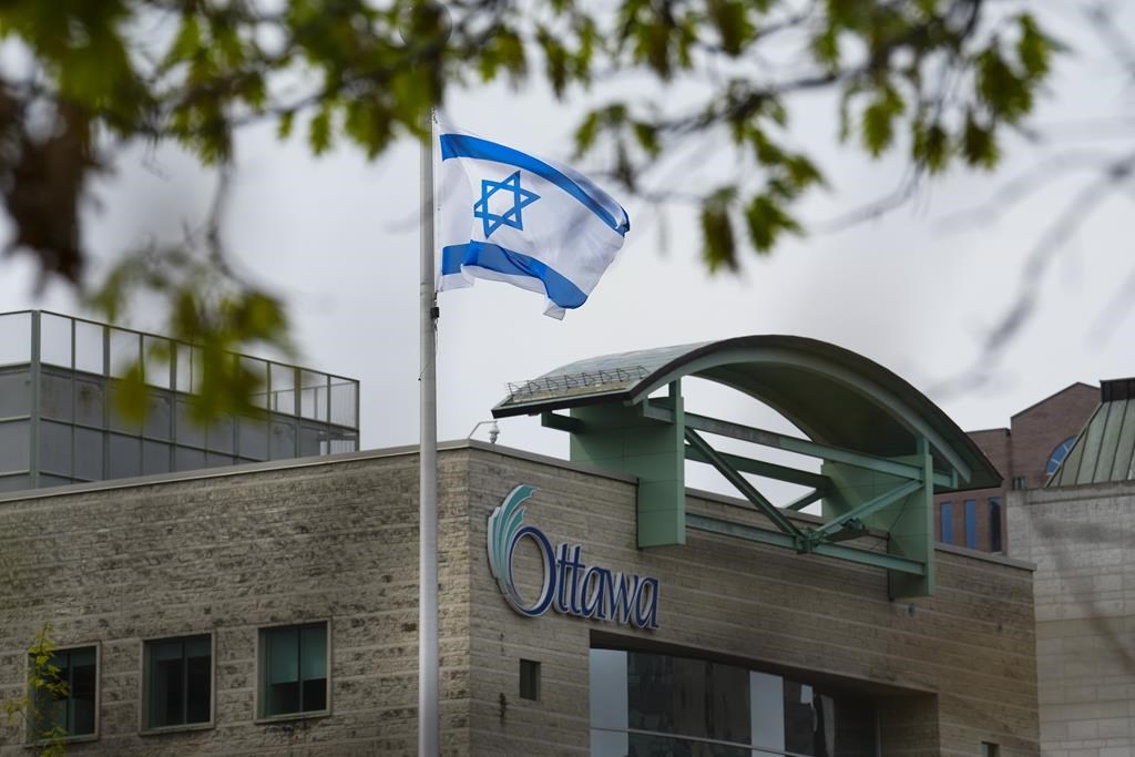 The Israeli flag flies in front of Ottawa City Hall after it was raised during a private event on Tuesday, May 14, 2024.