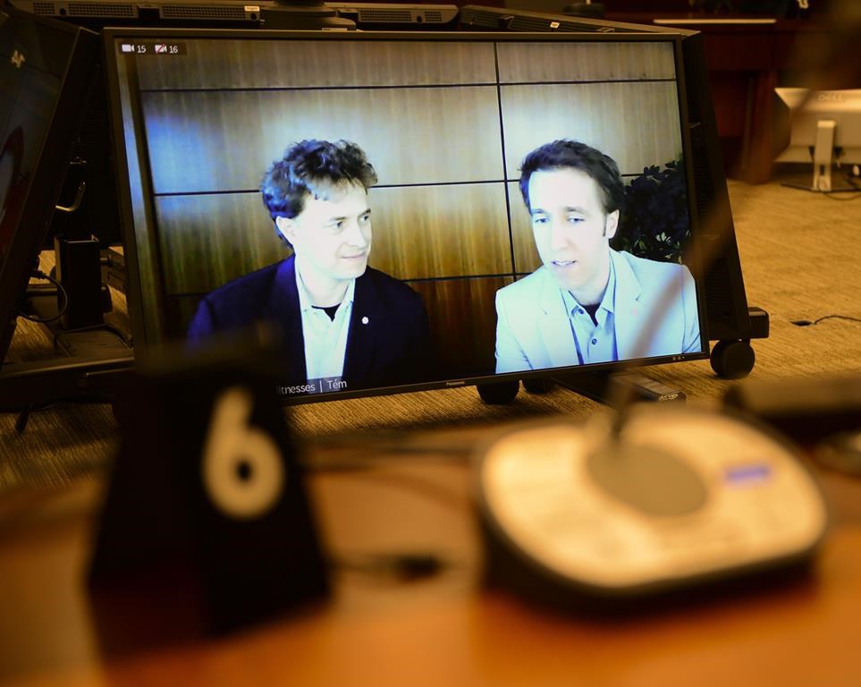 A defamation lawsuit filed by the mother of Marc and Craig Kielburger against the Canadaland podcast and its host will head to trial after an Ontario court rejected an application to have it thrown out, finding the claim has "substantial merit." Marc Kielburger, screen left, and Craig Kielburger, screen right, appear as witnesses via videoconference during a House of Commons finance committee in the Wellington Building in Ottawa, Tuesday, July 28, 2020. 