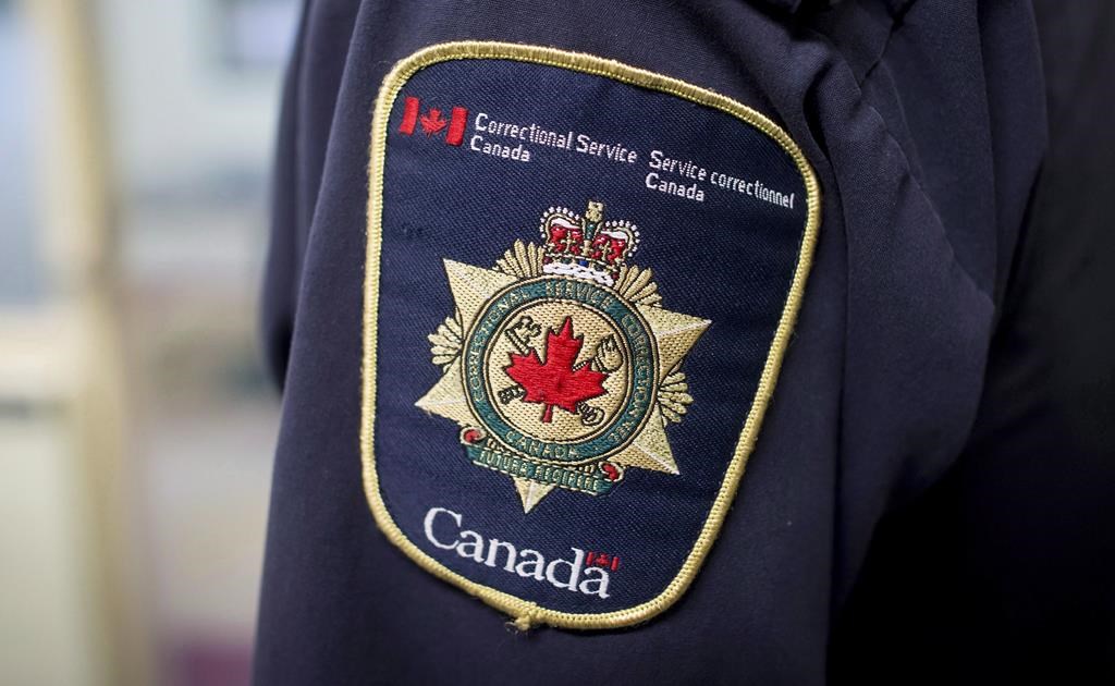 Correctional Service Canada says an unnamed inmate has been injured in what it's calling a major assault at the Port-Cartier Institution located on Quebec's north shore. Patches are seen on the arm and shoulder of a corrections officer in the segregation unit at the Fraser Valley Institution for Women during a media tour, in Abbotsford, B.C., on Thursday, Oct. 26, 2017. THE CANADIAN PRESS/Darryl Dyck.