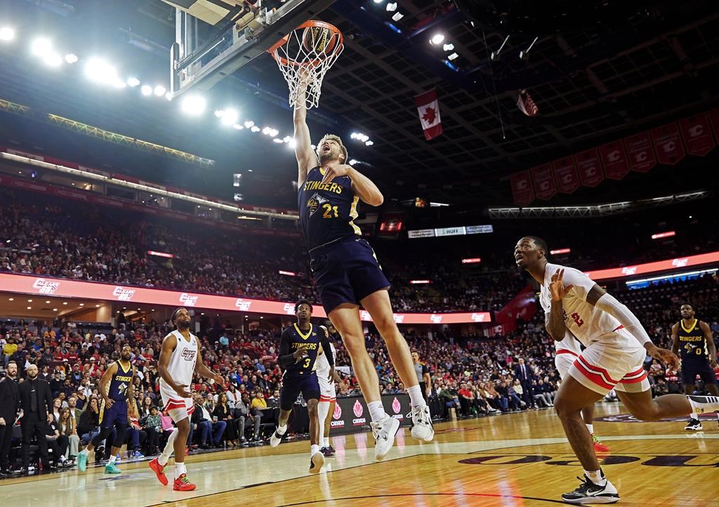 Edmonton Stingers' Ben Krikke (21) dunks against the Calgary Surge during CEBL basketball action in Calgary in this Tuesday, May 21, 2024 handout photo.