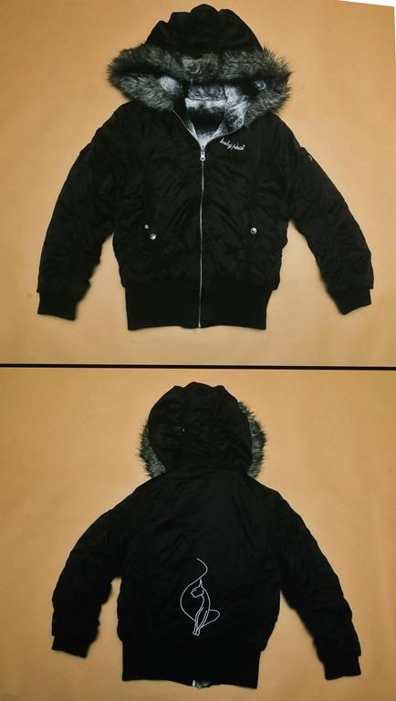 An evidence photo of a Baby Phat branded jacket is shown at a news conference for an ongoing homicide investigation in Winnipeg, Thursday, Dec. 1, 2022. THE CANADIAN PRESS/John Woods