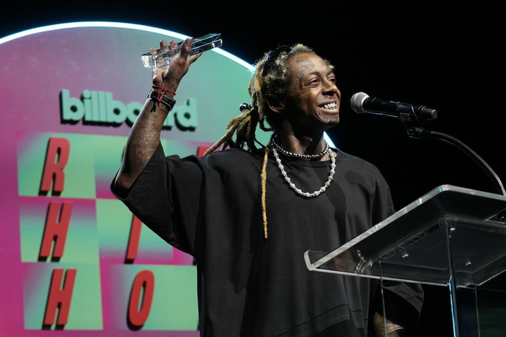 Lil Wayne collects the Hip-Hop Hall of Fame Inductee Award at Billboard R&B Hip-Hop Live, celebrating of the 50th anniversary of hip-hop, at The Novo in Los Angeles, Tuesday, Aug. 8, 2023. 