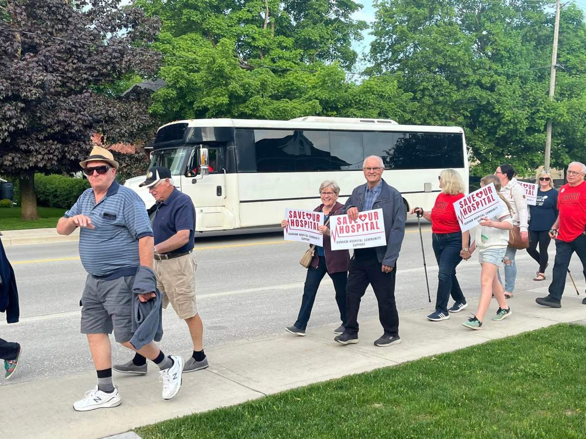 Community members marching to save the South Bruce Grey Health Centre in Durham, Ont.