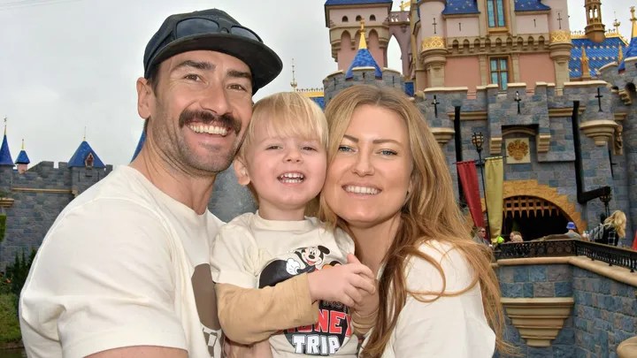 Family photo of Karl, Bodhi and Cristy Naaf at Disneyland.