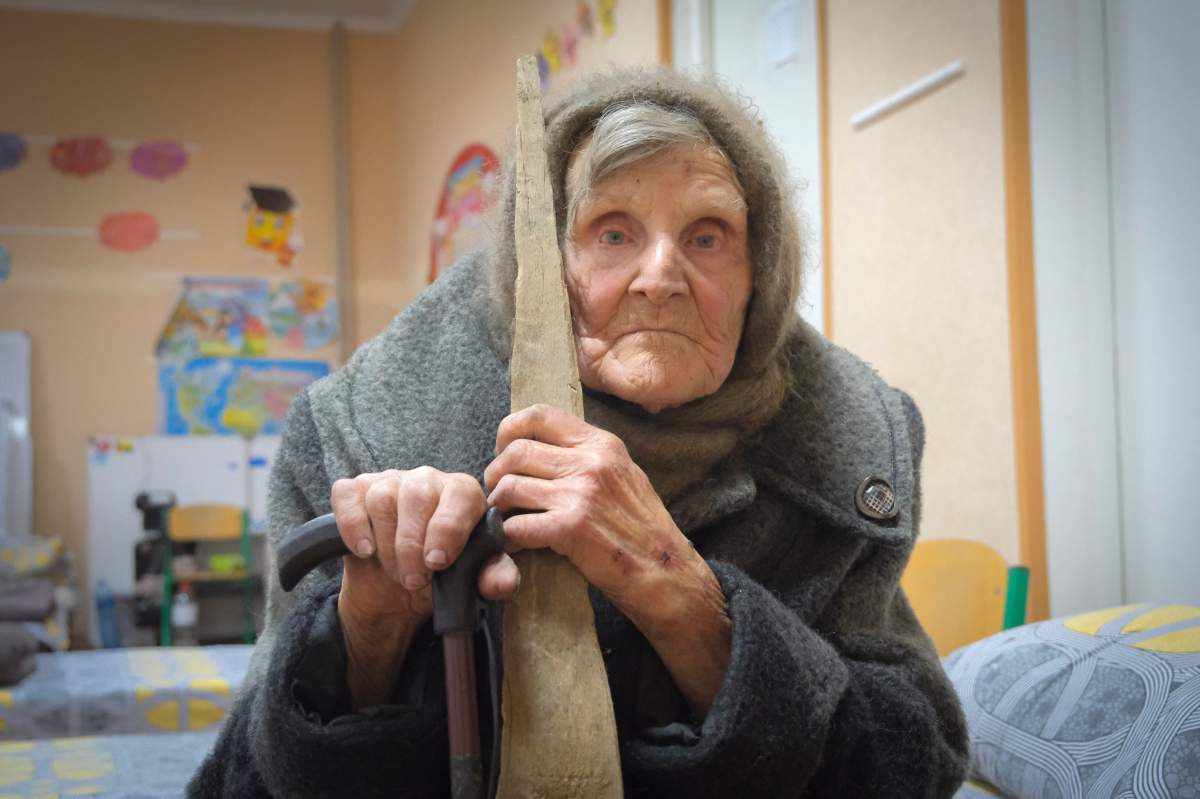 In this photo provided by the Ukrainian National Police of Donetsk region, 98-year-old Lidia Lomikovska sits in a shelter after she escaped Russian-occupied territory in the Donetsk region, Ukraine, April 26, 2024. Lomikovska left the frontline town of Ocheretyne last week by walking almost 10 kilometres alone, after Russian troops entered it and fighting intensified.