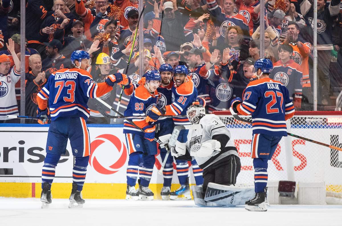 Los Angeles Kings goalie David Rittich (31) looks on as Edmonton Oilers' Vincent Desharnais (73), Ryan Nugent-Hopkins (93), Leon Draisaitl (29), Evander Kane (91) and Brett Kulak (27) celebrate a goal during first period NHL playoff action in Edmonton on Wednesday May 1, 2024.