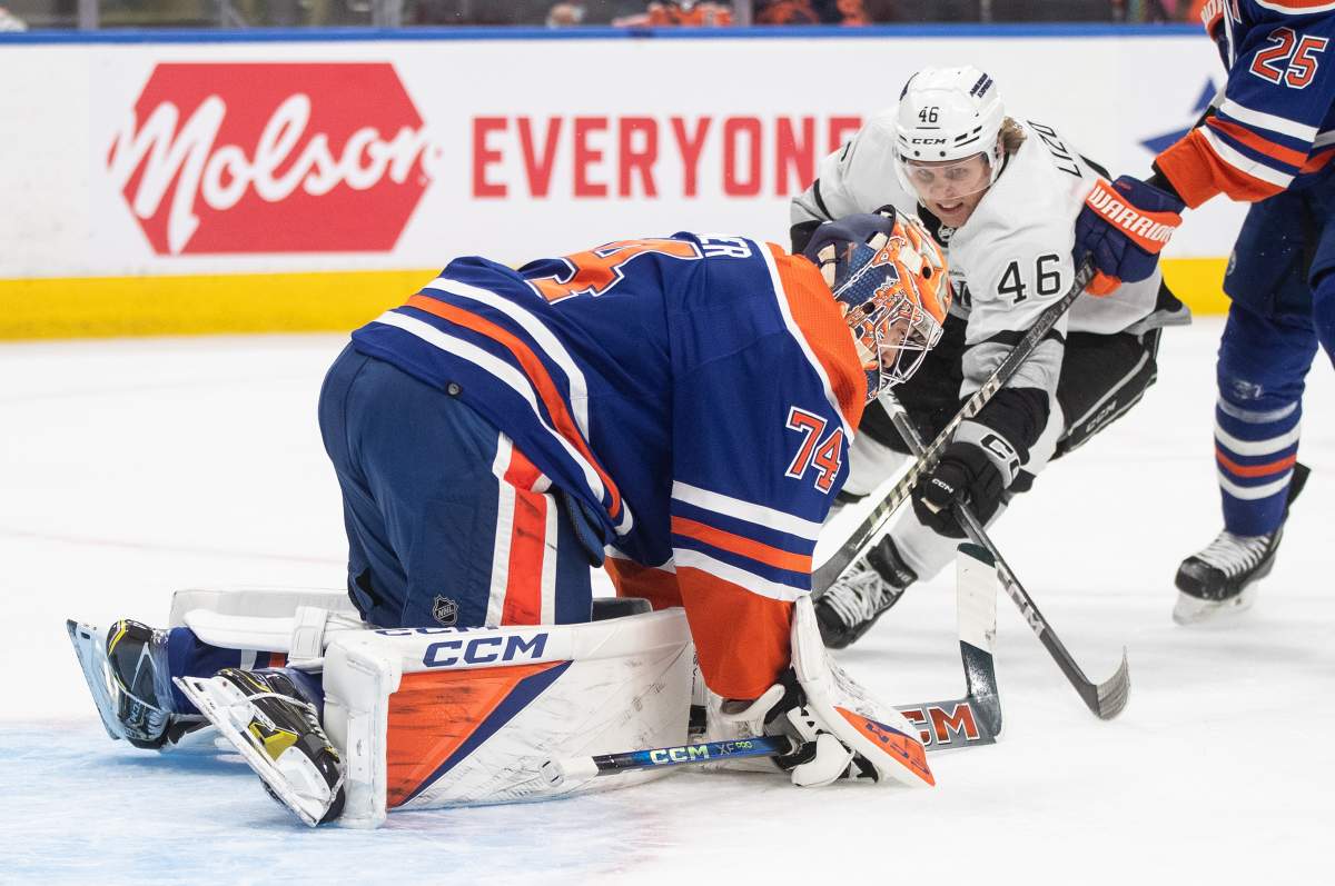 Los Angeles Kings' Blake Lizotte (46) is stopped by Edmonton Oilers goalie Stuart Skinner (74) during first period NHL playoff action in Edmonton on Wednesday May 1, 2024.