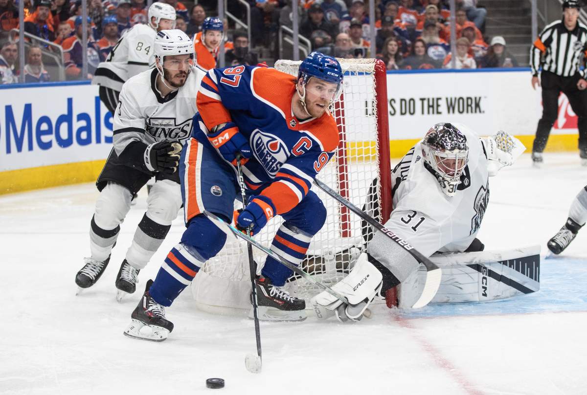 Los Angeles Kings' Matt Roy (3) chases Edmonton Oilers' Connor McDavid (97) as goalie David Rittich (31) poke checks the puck during second period NHL playoff action in Edmonton on Wednesday May 1, 2024.