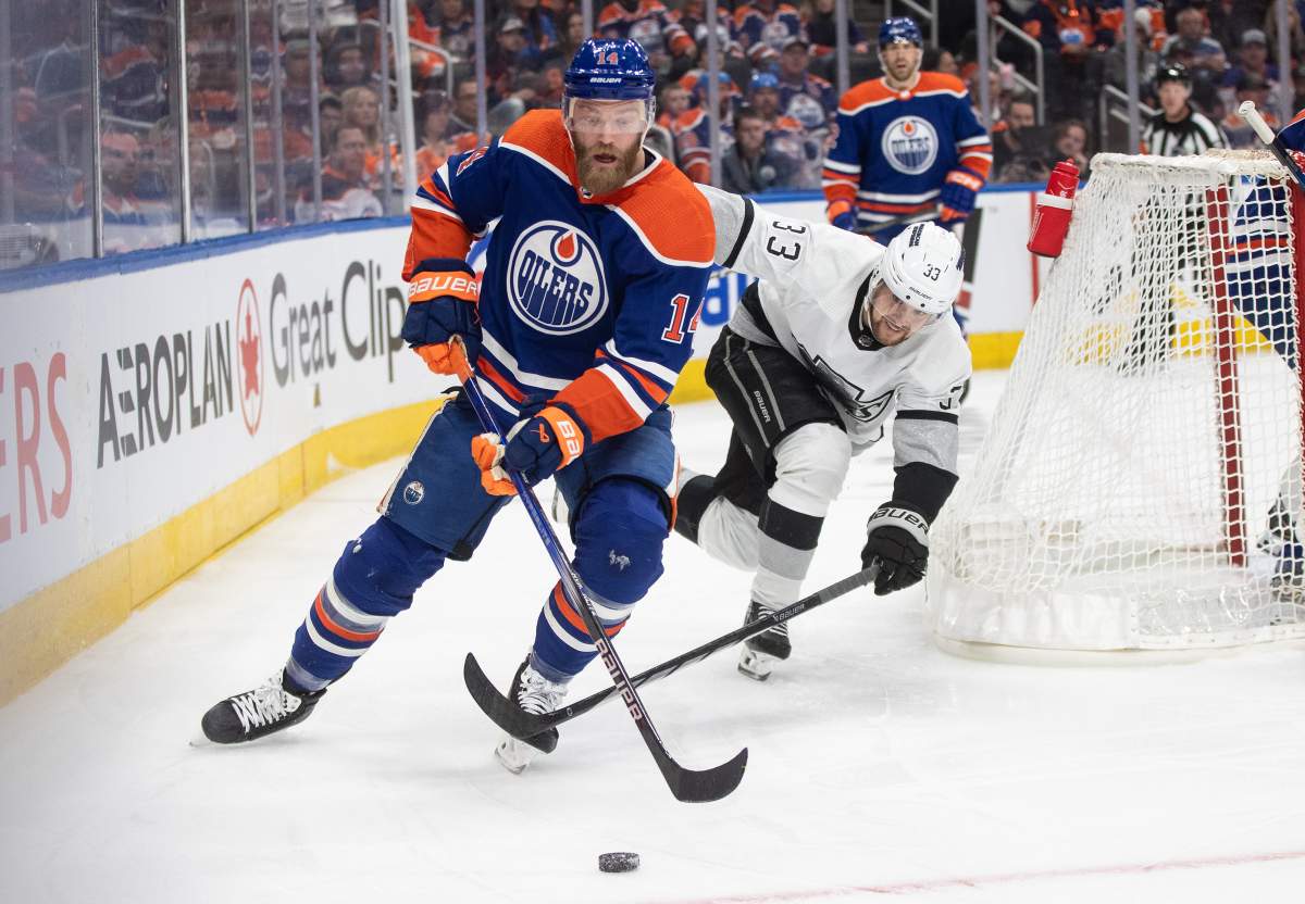 Los Angeles Kings' Viktor Arvidsson (33) chases Edmonton Oilers' Mattias Ekholm (14) during third period NHL playoff action in Edmonton on Wednesday May 1, 2024.