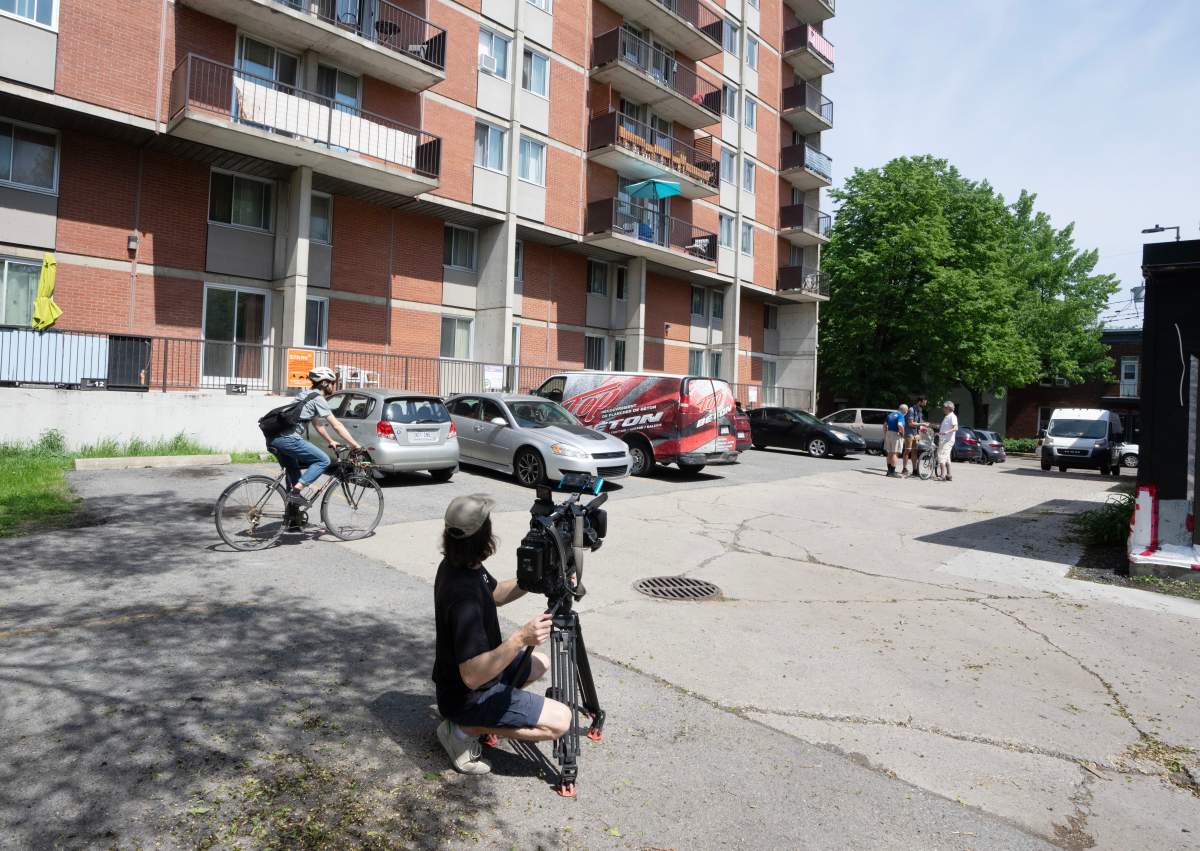 A cameraperson shoots at the scene of a fight that left three people dead, Wednesday, May 22, 2024 in Montreal.