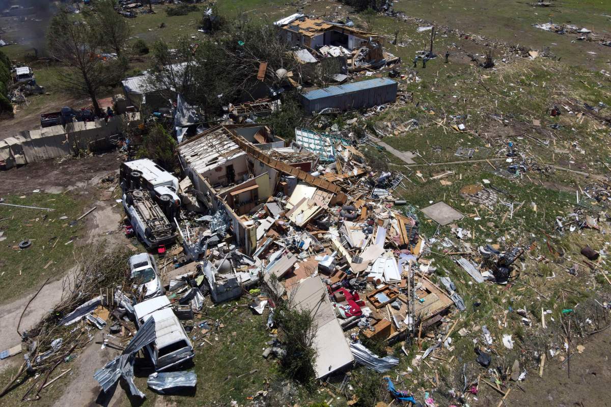 Destroyed homes are seen after a deadly tornado rolled through the previous night, Sunday, May 26, 2024, in Valley View, Texas. Powerful storms left a wide trail of destruction Sunday across Texas, Oklahoma and Arkansas after obliterating homes and destroying a truck stop where drivers took shelter during the latest deadly weather to strike the central U.S. (AP Photo/Julio Cortez)