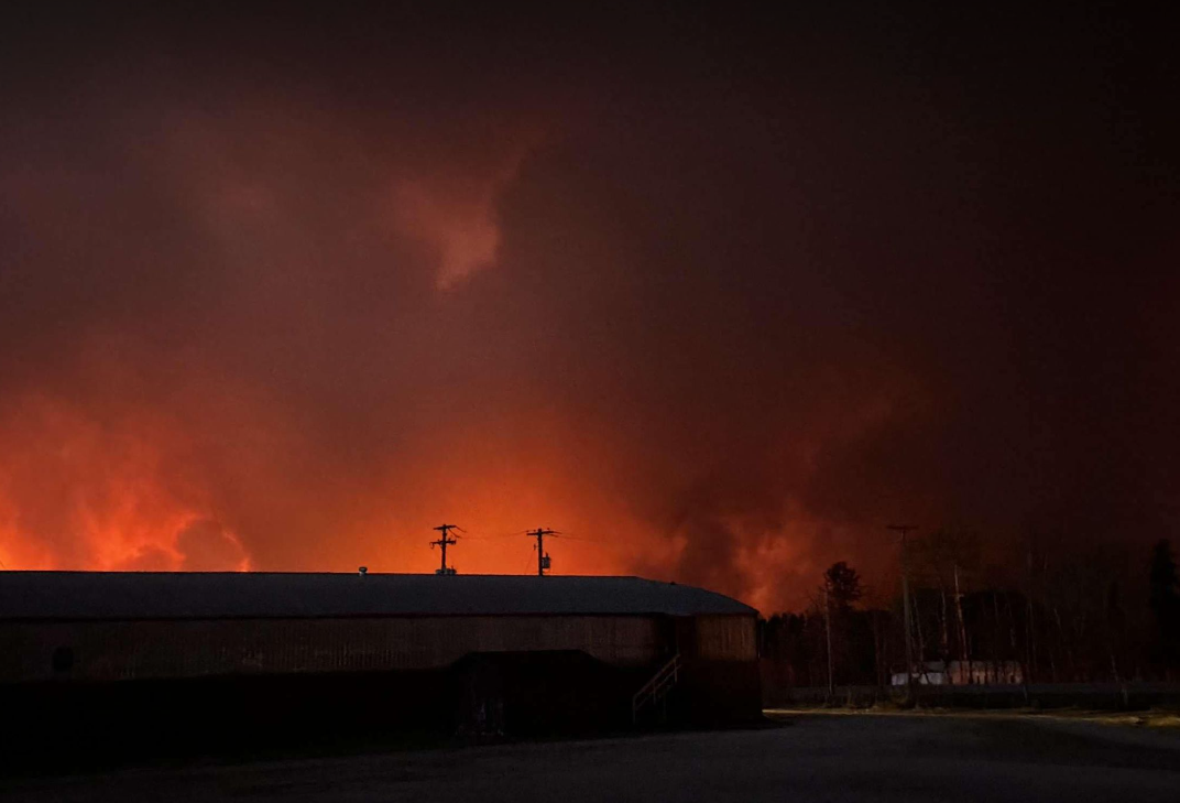 A wildfire burns closely to the community of Cranberry-Portage, Man.