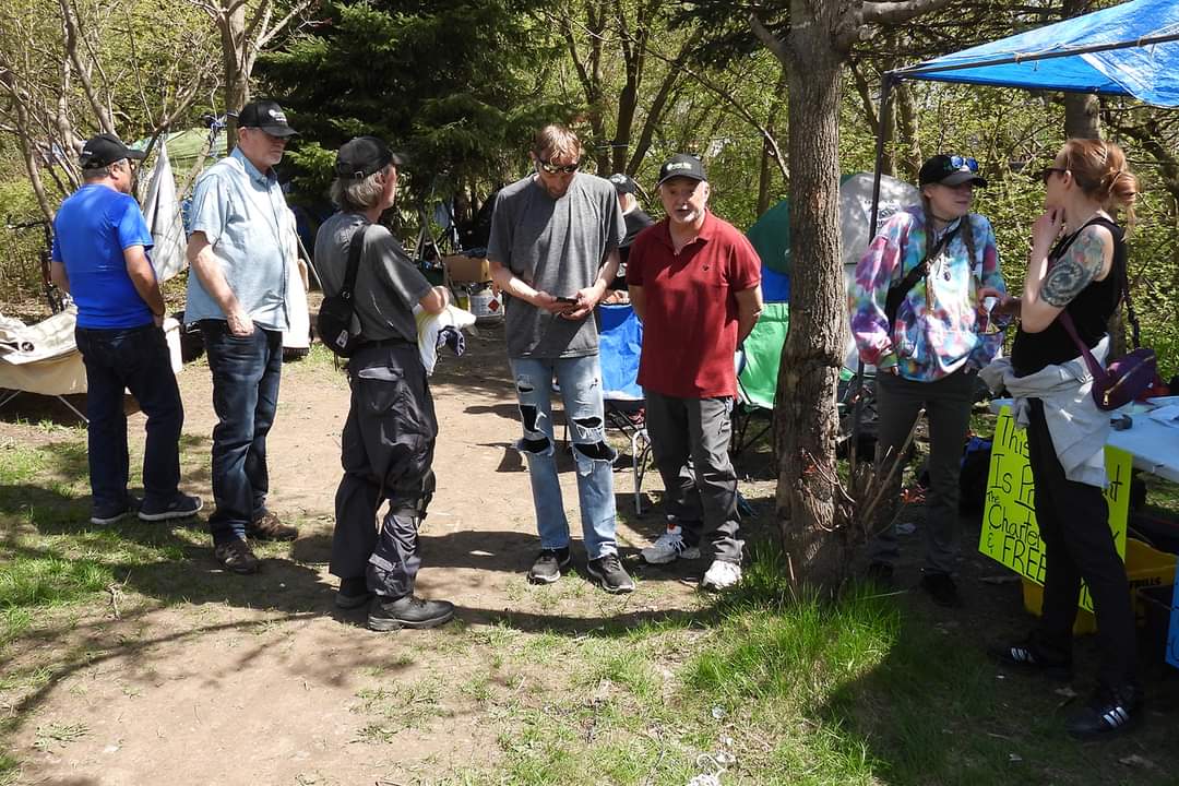 People at the Milligan’s Park homeless encampment in Barrie, Ont.