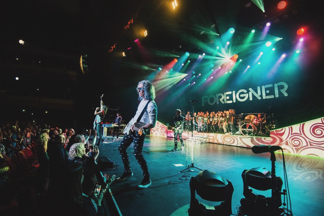 Guelph Collegiate Vocational Institute's chamber choir has been invited to perform with rock bands Foreigner and Wilco in June and July respectively.