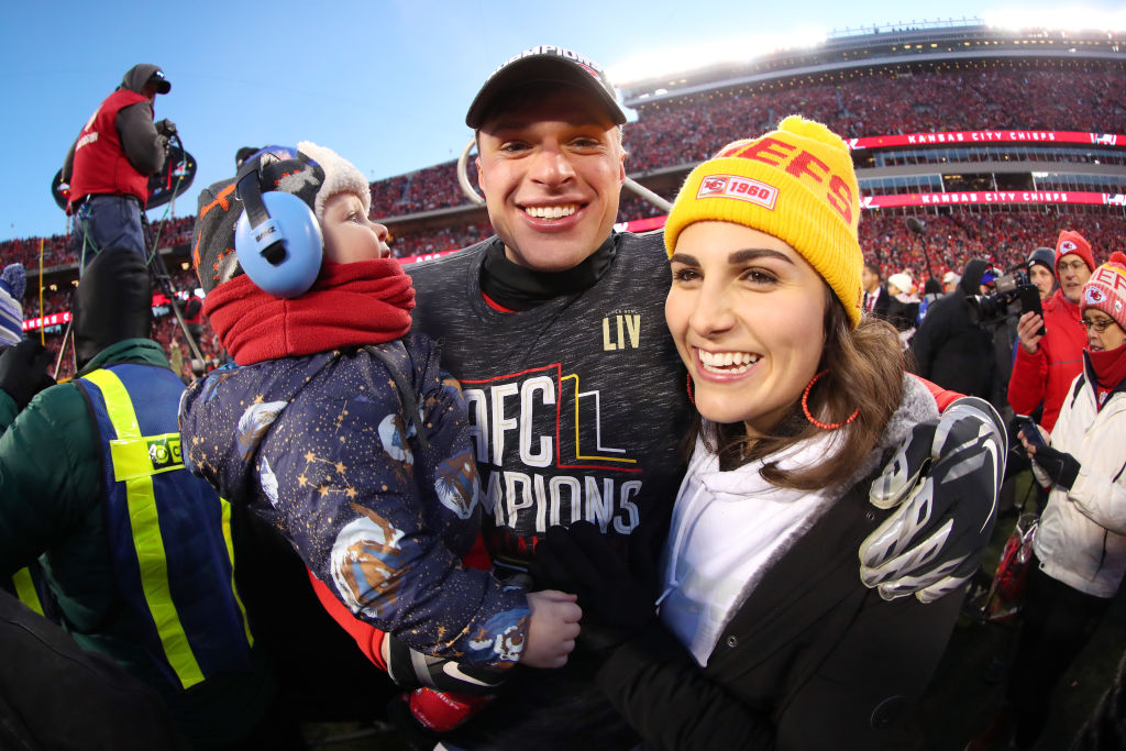 Harrison Butker #7 of the Kansas City Chiefs celebrates on the field with his wife, Isabelle, after defeating the Tennessee Titans in the AFC Championship Game at Arrowhead Stadium on January 19, 2020 in Kansas City, Missouri.