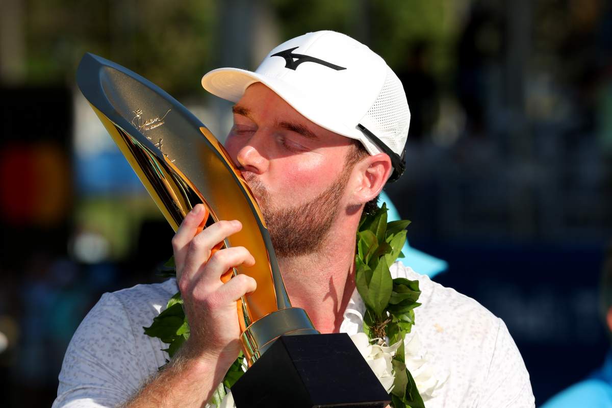 Grayson Murray poses with the Sony Open championship trophy after victory on the first play-off hole during the final round play at the Waialae Country Club on January 14, 2024 in Honolulu, Hawaii.