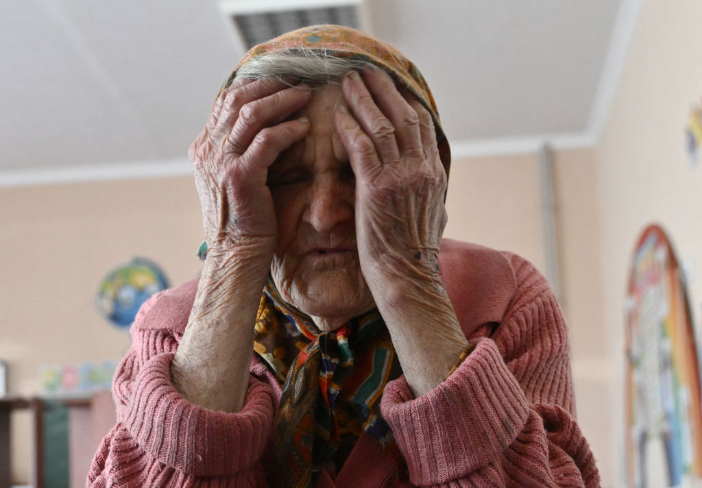 In this photo provided by the Ukrainian National Police of Donetsk region, 98-year-old Lidia Lomikovska sits in a shelter after she escaped Russian-occupied territory in the Donetsk region, Ukraine, April 26, 2024. Lomikovska left the frontline town of Ocheretyne last week by walking almost 10 kilometres alone, after Russian troops entered it and fighting intensified.