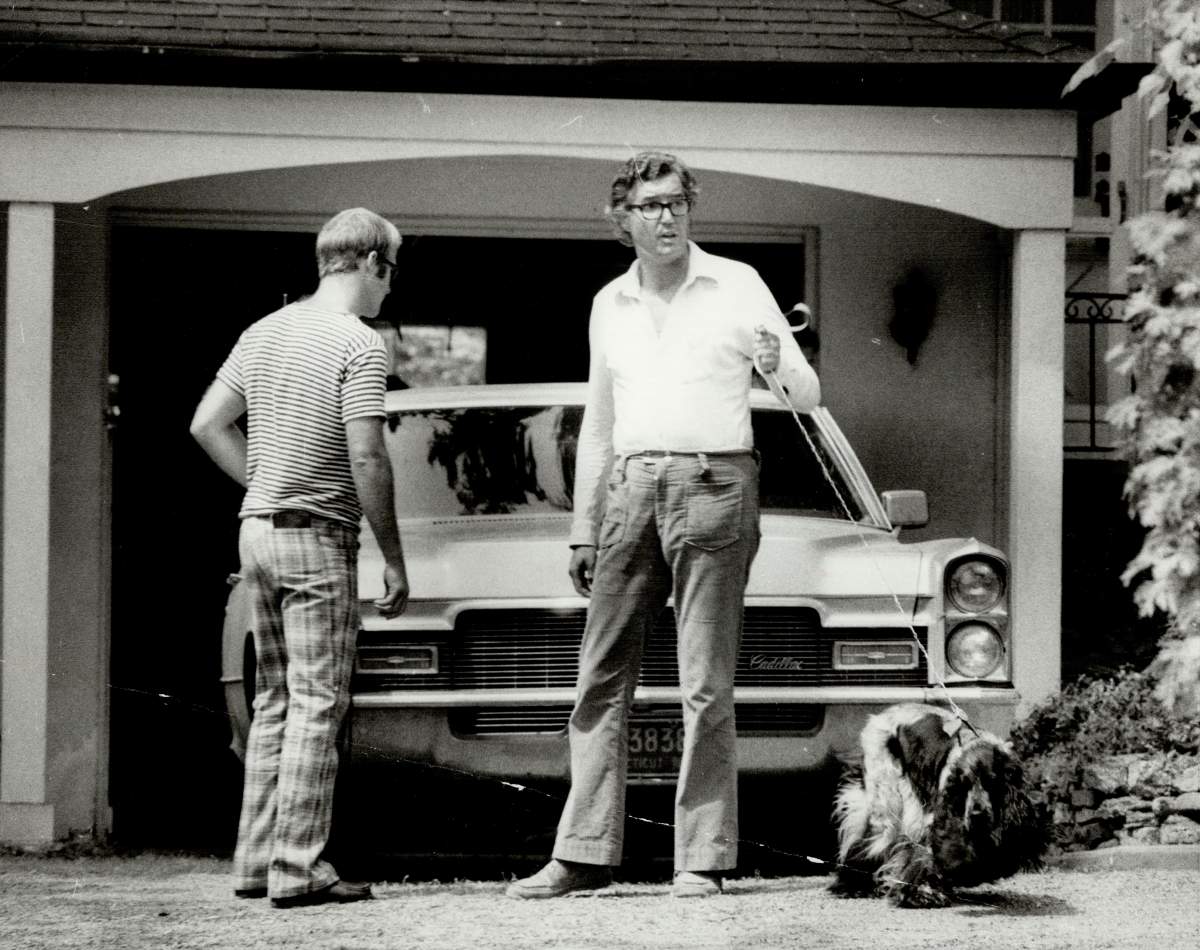 Peter Demeter is seen outside the garage where his wife was found bludgeoned to death.