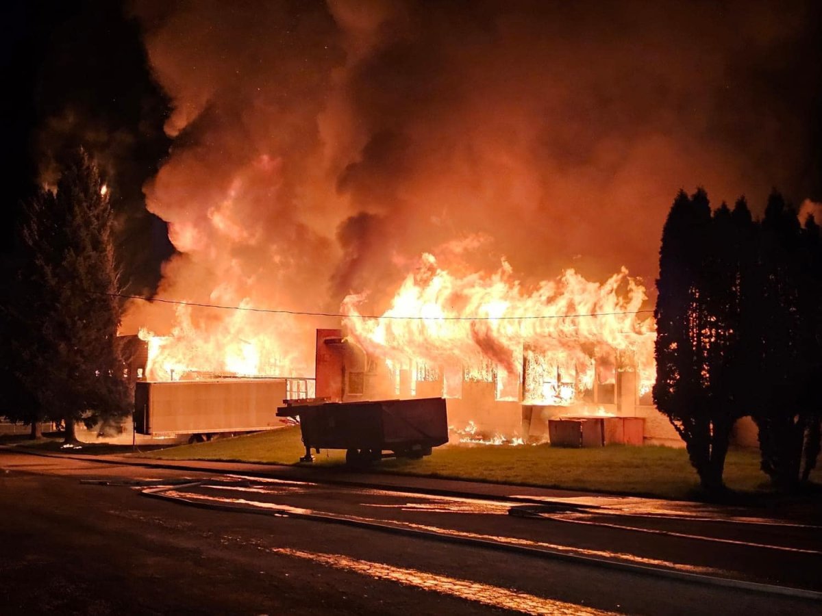 Fire consumes a former school along South Government Street in Greenwood, B.C., on Thursday night, May 9, 2024.
