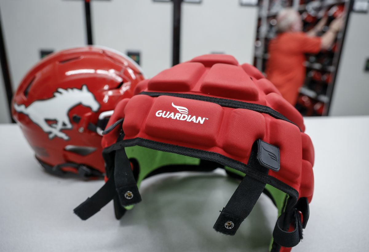 CFL players will have the option of wearing Guardian caps during games this season but mouthguards will be mandatory. A Guardian cap and a non-covered helmet are displayed at a Calgary Stampeders practice in Calgary on Tuesday, June 6, 2023.