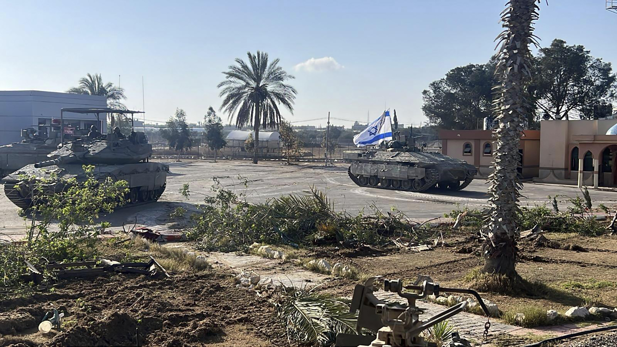 Amid ceasefire talks, Israeli forces seize control of Rafah border crossing in Gaza