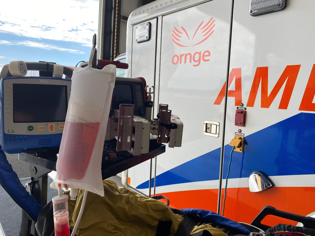 Simulation blood in front of the Ornge ambulance.