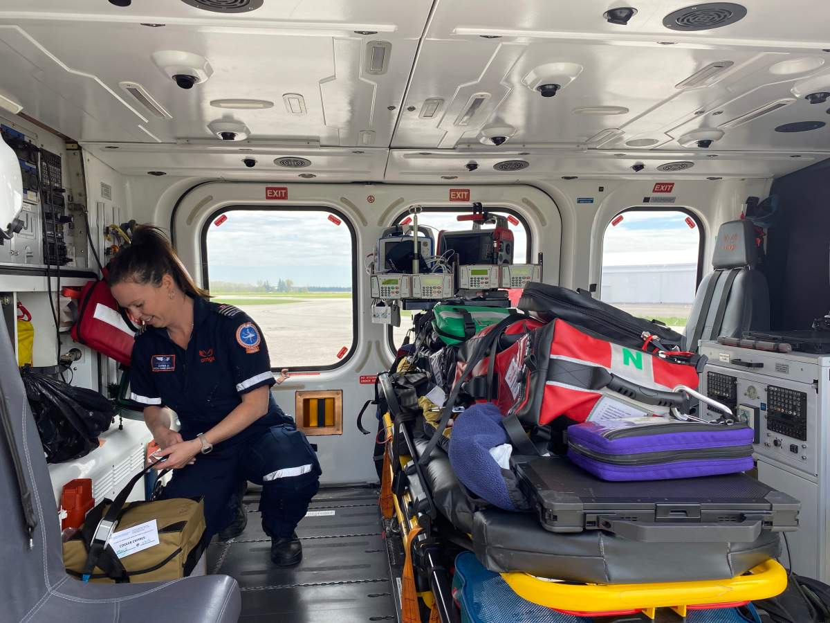 Critical care paramedic Dana Hamilton preparing the blood cooler for transport in the Ornge helicopter.