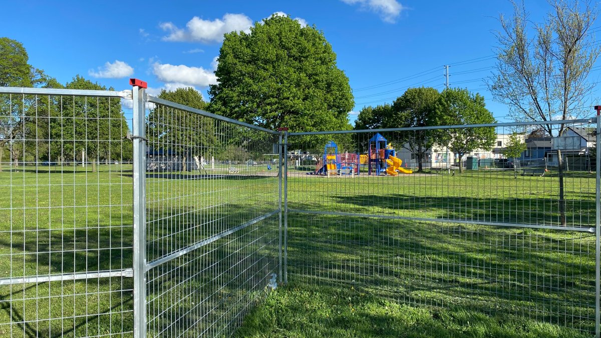 A playground structure at Mountain Drive Park near Concession Avenue in Hamilton, Ont was fenced off in May 2024 after contaminated soil was discovered at the site.