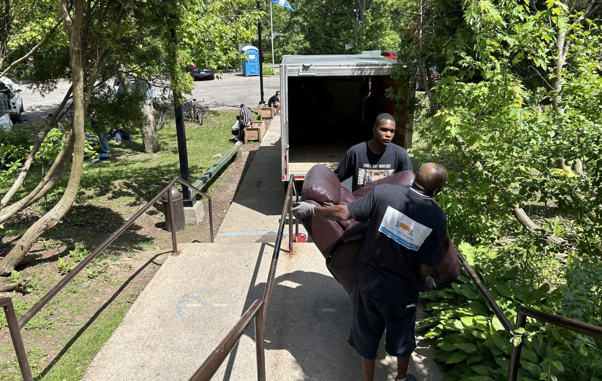 Movers are seen removing furniture from Ricochet emergency overnight shelter as the service closes its doors.