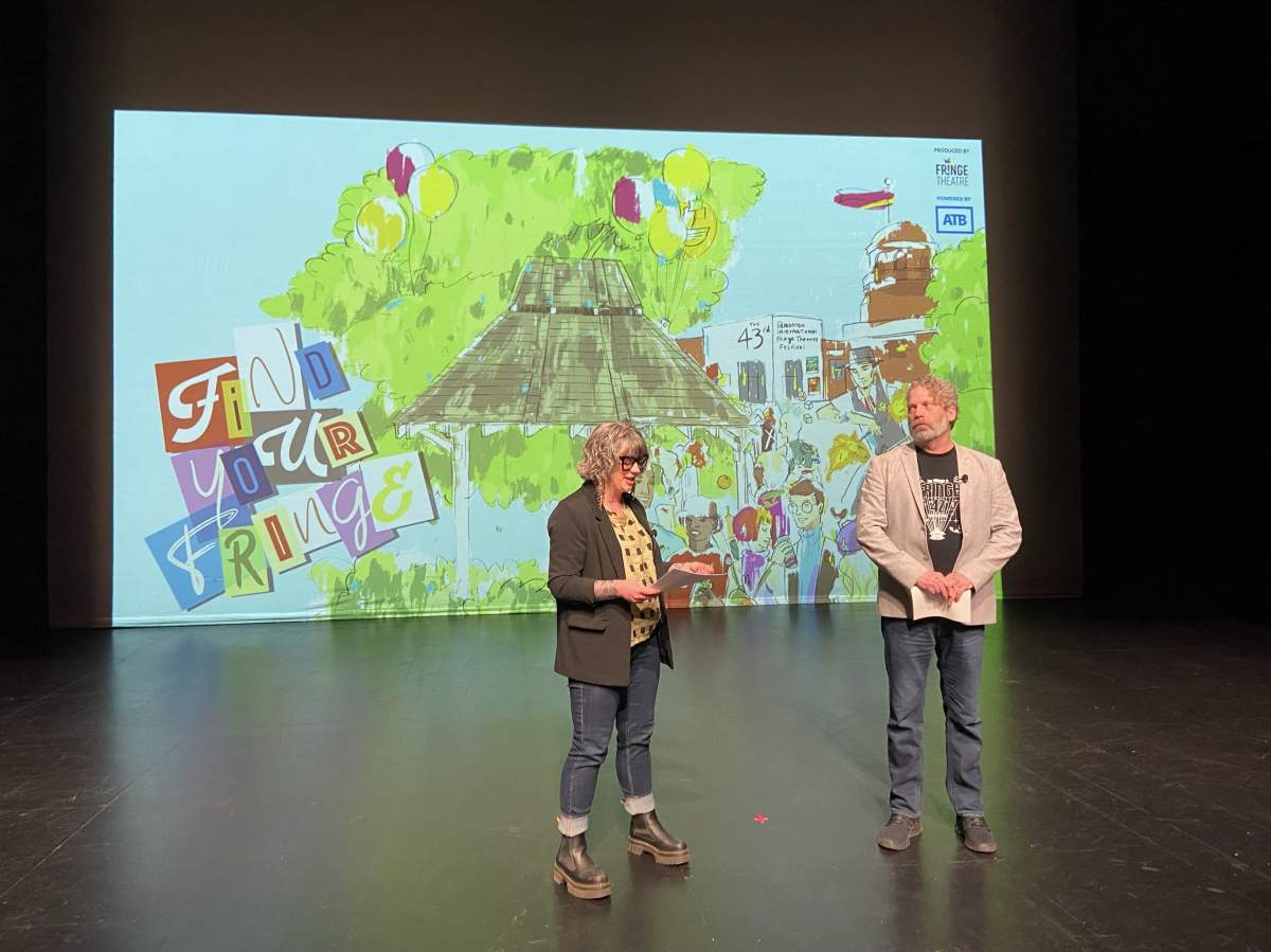 Megan Dart, left, and Murray Utas, right, take part in an announcement to unveil unveil the theme of the Edmonton International Fringe Theatre Festival.