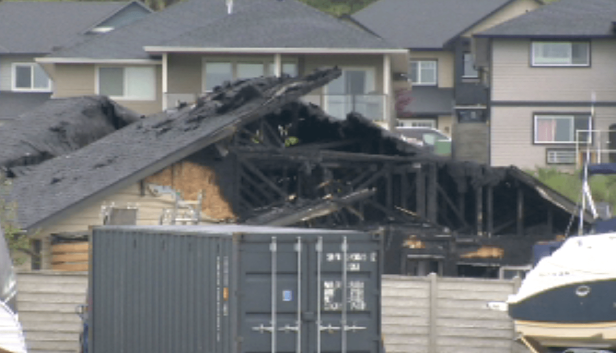 A view of the rear of the fire-damaged home on Shetland Road in Kelowna, B.C., on Sunday, May 26, 2024.