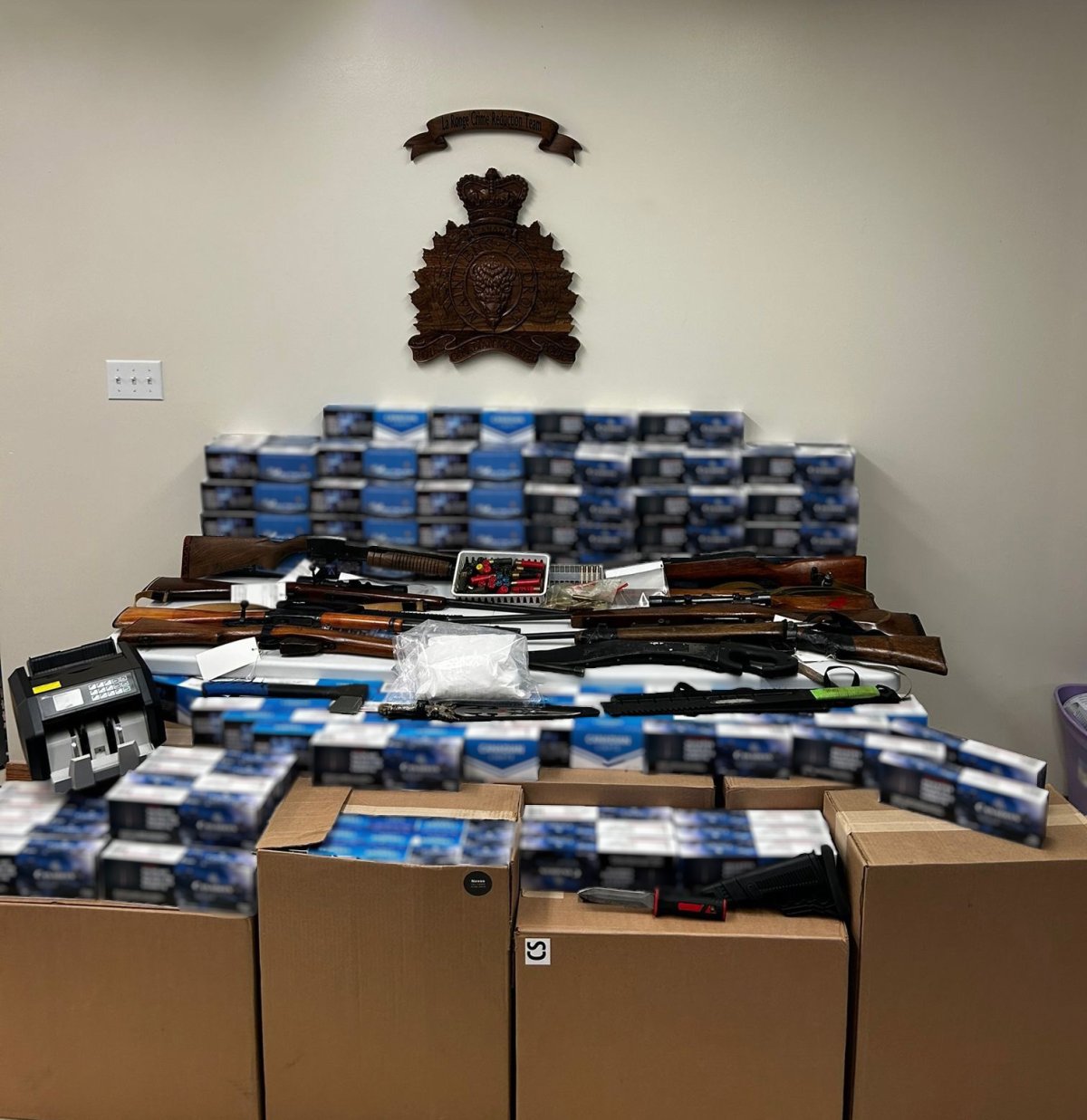 Saskatchewan RCMP say they seized 110,000 illegal cigarettes, one kilogram of morphine powder, eight firearms, and trafficking paraphernalia in the La Ronge area during a bust on May 16.