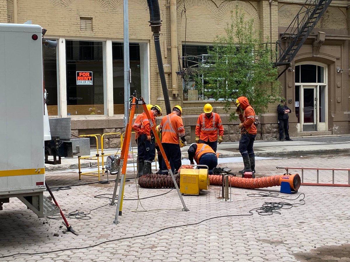 Manitoba Hydro crews on Albert Street work to restore power to downtown Winnipeg.