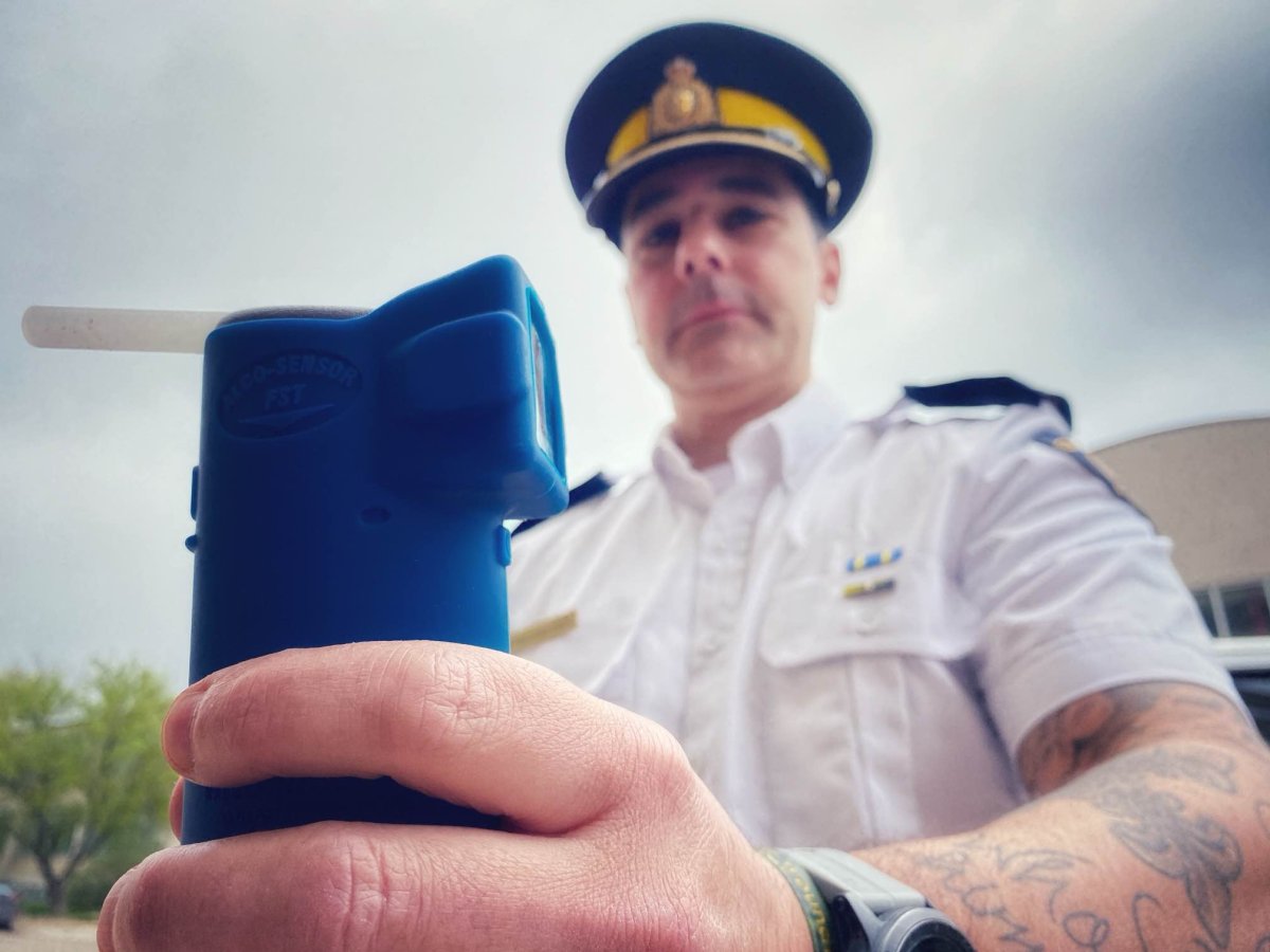 Insp. Michael Gagliardi of the Manitoba RCMP shows off an alcohol screening device.