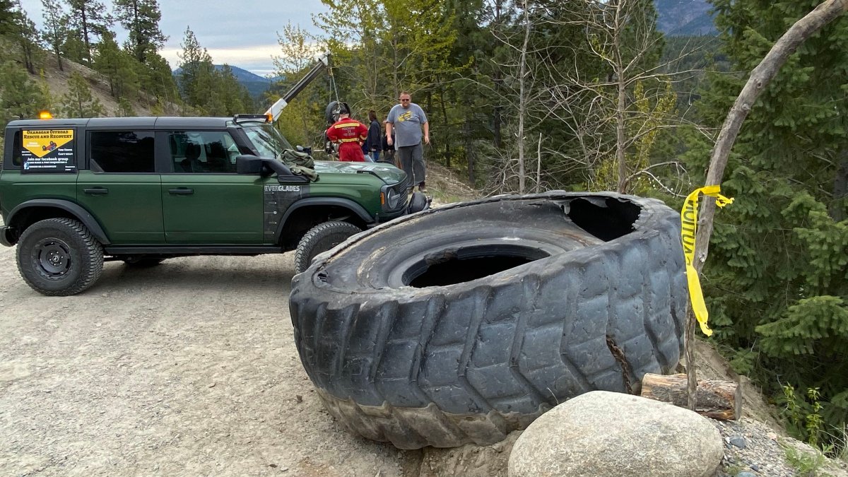 A massive tire was one of several items pulled from a steep ravine during a cleanup on Saturday in Peachland’s watershed.