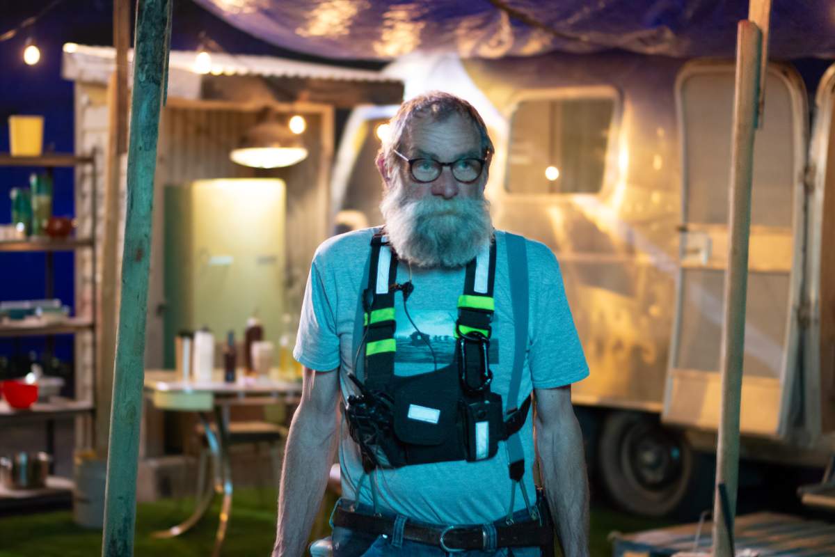 A crew member on the set of Hostile Takeover.