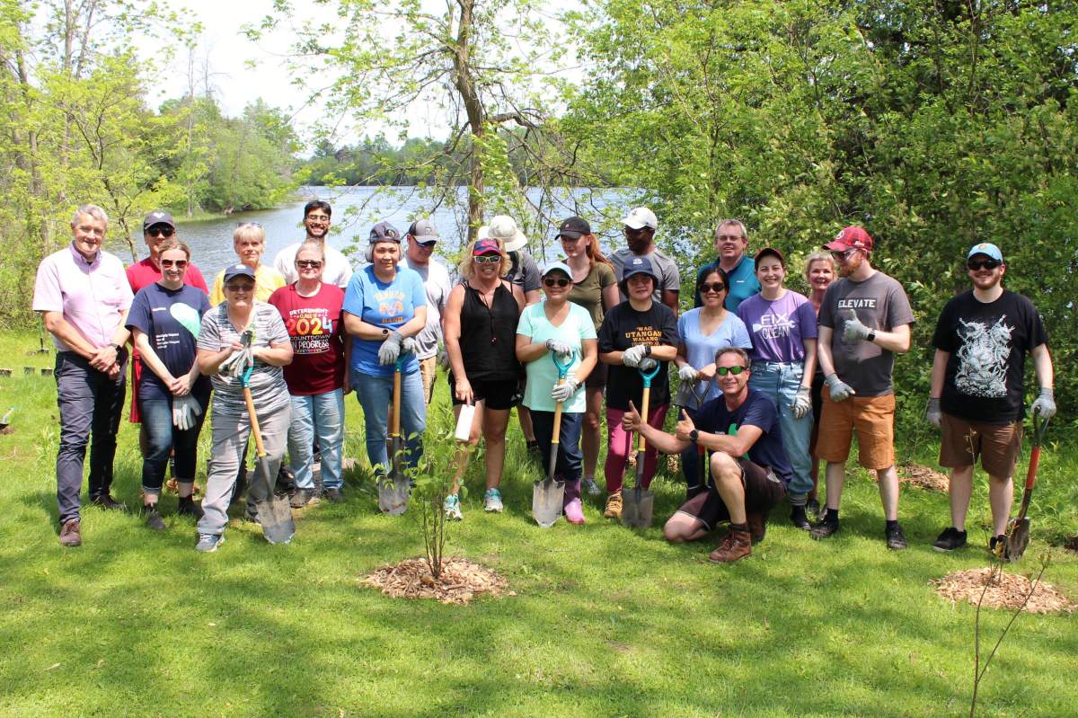 Siemens Canada employees from Peterborough, Ontario planted 100 native trees and shrubs at Riverview Park and Zoo.