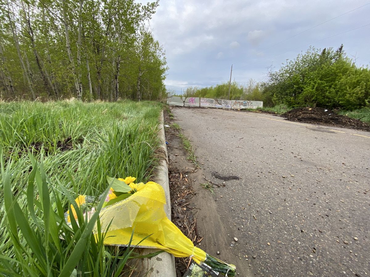 Homicide detectives are investigating after a 15-year-old boy died from injuries suffered on the border between St. Albert and Edmonton on Tuesday evening. Flowers placed at the scene were seen on May 23, 2024.